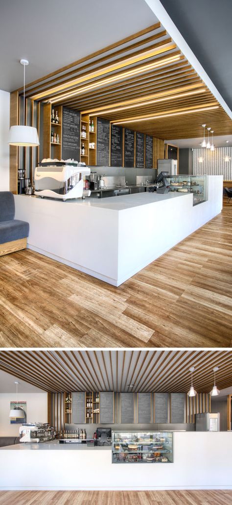 This cafe service counter mixes white counters with glass, wood detailing and chalkboards. Hidden lighting runs overhead along the the wooden details. Cafe Counter, Hidden Lighting, Sandwich Bar, Cozy Coffee Shop, Kiosk Design, Coffee Shops Interior, 카페 인테리어 디자인, Counter Design, Coffee Shop Design