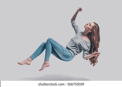 Hovering beauty. Full length studio shot of attractive young woman hovering in air and keeping eyes closed Hovering Pose, Women Images, Floating In The Air, Best Photo Background, Dark Energy, Neutral Art, Astral Travel, Studio Shoot, Drawing Poses