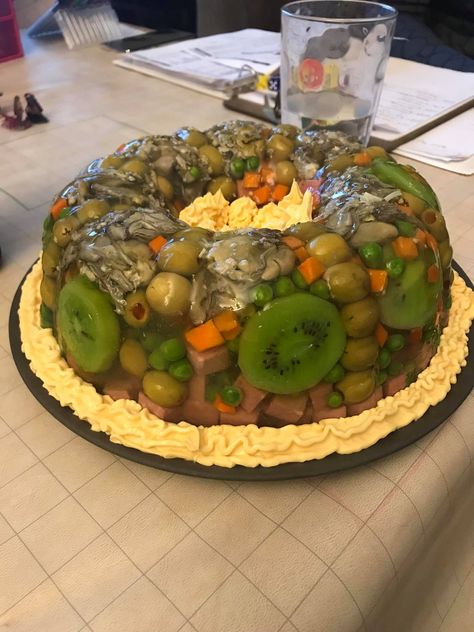 Oysters, carrots, kiwis, peas, spam and green olives in a gelatin aspic, garnished with easy cheese. Ugly Food, Food Fails, Gross Food, Easy Cheese, Green Olives, Kool Aid, Vintage Recipes, Food Items, Food Photo