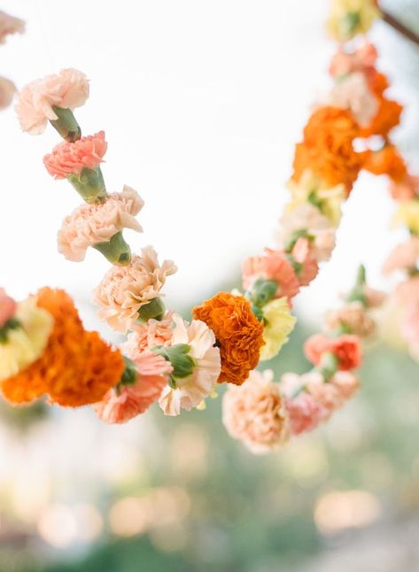 Marigold wedding inspiration in a wash of warm hues with peachy pink, orange and yellow flowers Pinks Oranges Wedding, Marigold Party Theme, Marigold Garland Wedding, Marigold Wedding Invitation, Marigold Invite, Marigold Floral Arrangement, Marigold Wedding Colors, Marigold Wedding Decor, Marigold Party