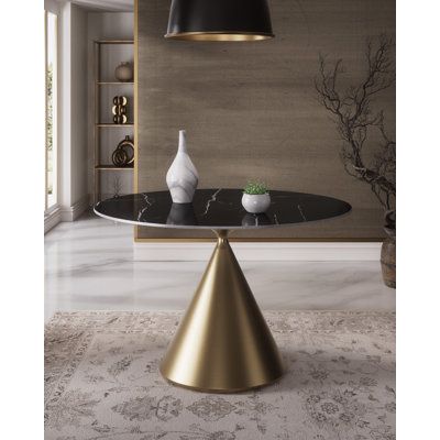 This eye-grabbing 47” Wide Round Dining Table is perfect for the kitchen, dining room, or break room area and is ideal for entertaining or everyday dining. The gold finish pedestal base and faux marble tabletop give it a mid-century flair and modern design, while the round shape provides plenty of space for up to 4 people. Whether you’re enjoying a meal with friends and family or just hanging out with coworkers, this table is sure to make the occasion special. So don’t wait any longer; add this Black Marble Round Dining Table, Round Marble Dining Table, Black Ivy, Break Room, 4 People, Modern Round, Faux Marble, Beautiful Table, Black Marble