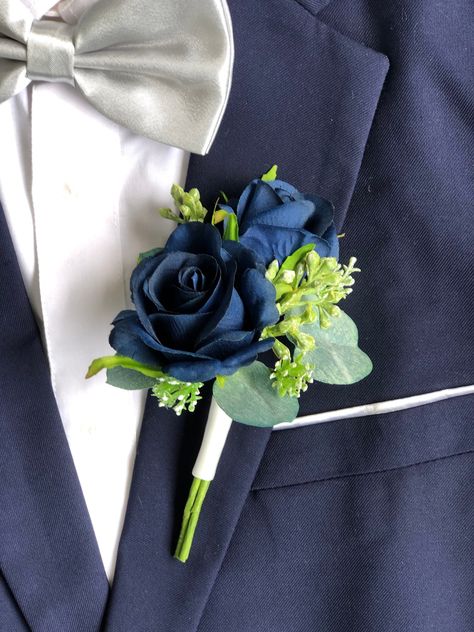 Navy Blue Rose Eucalyptus Artificial Boutonniere 💕Rare shade of navy blue faux flower wedding boutonniere for men 💕Premium wedding quality artificial flowers and sage green eucalyptus greenery 💕every boutonniere comes with a pearl head pin | measures 3.5in x 6in 💕Perfect for Groom | Best Man | Groomsmen | Ushers | Fathers | Grandfathers 💕artificial greenery wedding | seeded eucalyptus | silver dollar eucalyptus 💕10 different satin ribbon options to wrap the stem. Just make a note in the or Sage And Navy Bouquet, Dark Blue Boutonniere, Men’s Flowers For Wedding, Dusty Blue Corsage And Boutonniere, Navy Blue Corsage And Boutonniere, Blue Boutineer, Navy Blue And Sage Green Wedding, Sage Green And Navy Blue Wedding, Sage Green And Navy Wedding