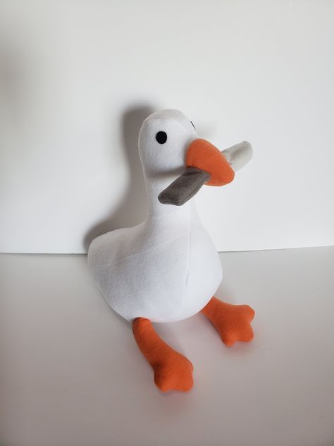 Hello, and thank you for viewing this item! This plush is made in the image of the Untitled Goose Game. Here are a few things about the product you may want to know: 1. Each individual plush is handmade special by me and takes up to 1-2 weeks to complete the plush after it is completed the plush will be shipped. The shipping I usually use is first-class 2-5 business days. If you would like the shipping to be sooner please message me about additional shipping rates. 2. The plush is made with flee Goose With Knife, Goose Plush, Untitled Goose Game, Goose Game, Walpapers Cute, Duck Wallpaper, Funny Duck, Cute Stuffed Animals, Fabric Dolls