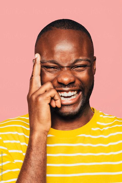 View "Portrait Of Handsome Black Man Looking At Camera While Laughing" by Stocksy Contributor "VICTOR TORRES" - Stocksy Black Man Laughing, Hand On Face, Colourful Portrait, African Image, Hands On Face, Young Black, Yellow T Shirt, African Men, Black Man