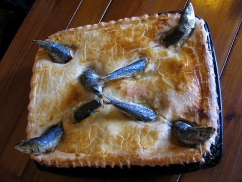 Stargazy pie is an odd-looking invention—a dish where fish gaze up at the sky from a buttery crust—but it's more, too. It's said to be born of famine. Stargazey Pie, Roly Poly Pudding, British Foods, Toad In The Hole, Fish Pie, Boozy Desserts, Christmas Dishes, Irish Recipes, British Food