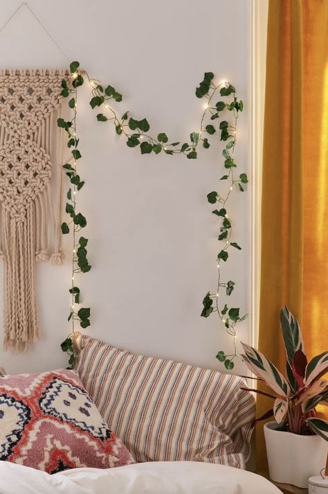 Some faux ivy string lights that'll look ~de-vine~ no matter where you hang them. Cute String Lights, String Lights Living Room, Vine String Lights, Christmas Lights In The Bedroom, Boho Dorm Decor, Boho Dorm, Ivy Vine, Hanging Vines, Bedroom Ceiling