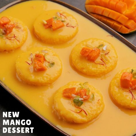 Try this new and easy mango dessert that everyone at your home will love! | dessert, mango, recipe | Try this new and easy mango dessert that everyone at your home will love! #Mango #Recipes #AartiMadan | By Aarti Madan Mango Rasmalai, Mango Custard, Mango Recipe, Mango Dessert, Custard Powder, Sweet Recipe, Mango Puree, Mango Recipes, Cardamom Powder