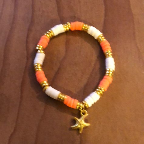 Hand Crafted Clay Bead Bracelet With Star Fish Charm. Orange And White With Gold. Smoke Free Home. Perfect For That Beach Vacation. Patterns For Clay Bead Bracelets, Cute Orange Bracelet, Orange Clay Bracelets, Brown Clay Bracelet Ideas, Clay Bracelets Summer, Clay Bead Bracelet Ideas With Charms, Big Bead Crafts, Smiley Clay Bead Bracelet, Preppy Beach Clay Bead Bracelets