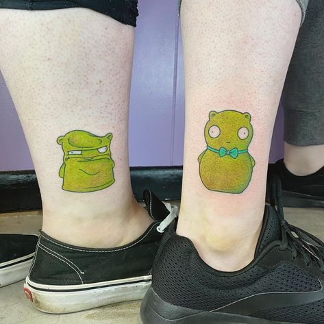 Annie Burkhard on Instagram: “Just a couple of Kuchi kopi sister tats, thanks for coming to me for a @bobsburgersfox tattoo 💚💚scroll 👉 for metal version.” Bob Burger Tattoo, Kuchi Kopi Tattoo, Bobs Burger Tattoo Ideas, Louise Bobs Burgers Tattoo, Subtle Bobs Burgers Tattoo, Bobs Burgers Tattoo Kuchi Kopi, Bob’s Burger Tattoo, Burger Tattoo, Bobs Burgers Tattoo