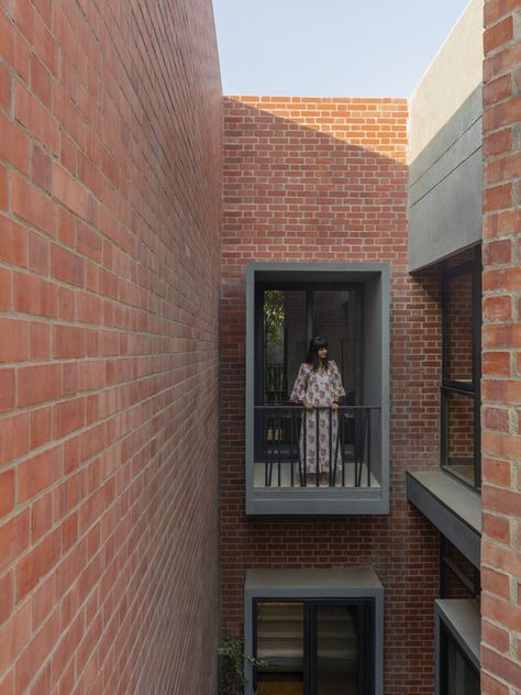 Set in a typical residential plotted development in the peripheral urban fabric of Amritsar, Perennial House is built in strong contradiction to its neighborhood dwellings. Within a linear site of 26’ x 62’, surrounded by plots on three sides, and facing the road on the south, specific attention to tackling the extreme climate of the region, as well as building a strong architectural vocabulary is given. Architectural Vocabulary, The Peripheral, Home Styles Exterior, Brick Cladding, Elevation Design, Brick Architecture, Exposed Brick Walls, Urban Fabric, Beach House Design