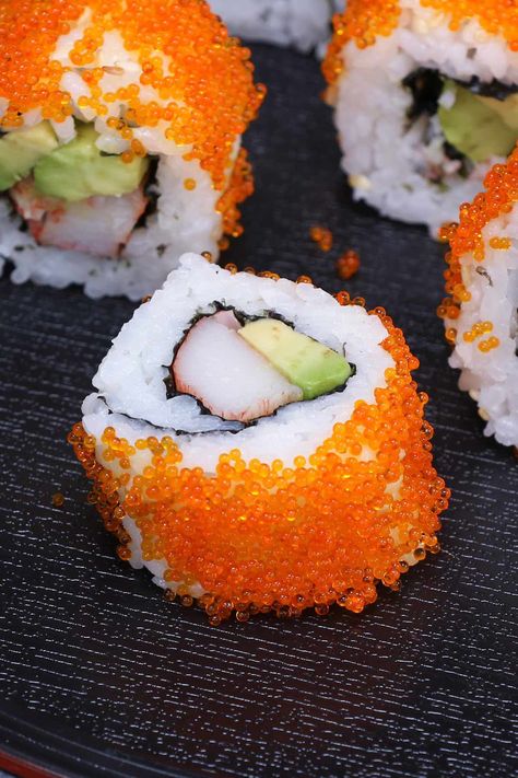 California roll sushi with a masago topping. Sushi With Fish Eggs, Masago Sushi, Sushi California Roll, Sushi Rolls Recipe, Inside Out Sushi, Sushi Ideas, California Roll Sushi, Healthy Sushi, Sushi Ingredients