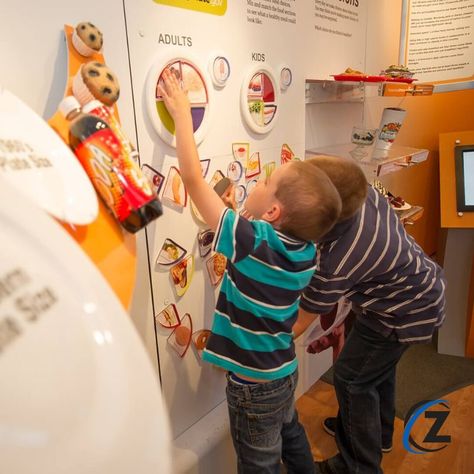 This exhibit trailer’s hands-on and interactive elements teach visitors about several aspects of good health. Here, the Nutrition Wall presents info on portion sizes and well-balanced meals. * #zentxmediagroup #publichealth #healtheducation #exhibit #interactivedisplay #handsonlearning #handsondisplay Health Class Posters, Nhd Exhibit Boards, Sensory Exhibition Design, Medical Exhibition Booth, Interactive Science Exhibition, Interactive Walls, Interactive Display, Balanced Meals, Irish Heritage