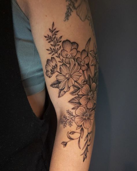 Black dotwork floral tattoo on the side of the elbow and upper arm. Violet Flower Tattoo Sleeve, Violet And Cosmos Flower Tattoo, Primrose Violet Tattoo, Violets And Primrose Tattoos, Tattoo Of Violets, Filler Flowers Tattoo, Purple Cosmos Flower Tattoo, Violet Tattoo Flower, Cosmos Tattoo