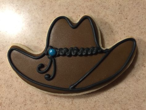 A Cowboy Hat cookie I made for a friend’s birthday Hat Cookies Decorated, Cowboy Hat Cookies, Nibbles Ideas, Cowgirl Cookies, Cowgirl Invitations, Cowboy Cookies, Hat Cookies, Cowboy Birthday Party, Cowboy Birthday