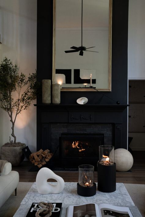 Black Fireplace Leather Couch, Loft Home Decor, Decorating Next To Fireplace, Double Height Fireplace Wall, Fireplace With Mirrors On Each Side, Simple Moody Living Room, Black Fireplace Mantel, White Winter Decor, Reclaimed Wood Bedroom