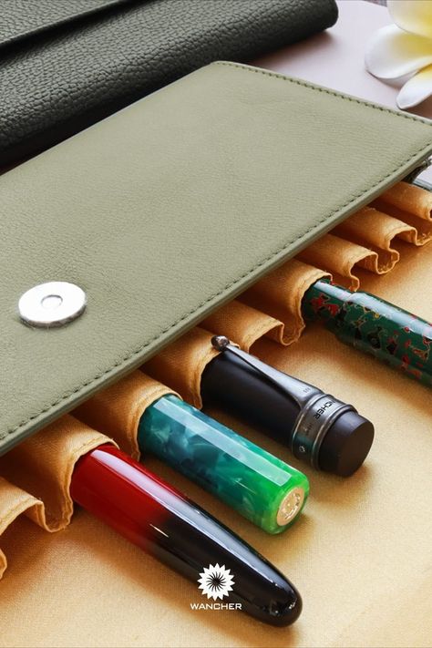 Safetly carry your valuable fountain pens using Wancher Penfolium 12 leather cases. The premium quality materials from European leather and Japanese craftsmanship ensure that the Penfolium is the perfect durable companion for your pens. #Wancher #Wancherleathercase #leathercase #fountainpencase #premiumquality #pencase #fashion #vintage #leatherproduct #green #aesthethic #pinterest #penpouch Japanese Ancient, Pen Pouch, Olive Green Color, European Vintage, Pen Case, Fountain Pens, Writing Instruments, Fashion Vintage, Fountain Pen