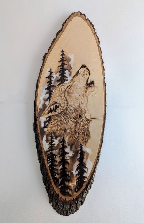 This is a wood burned portrait of a wolf on a live edge basswood round. The trees and area around the wolf are painted with acrylic paint. All of my designs are drawn on the wood round and then wood burned by hand and sealed with polyurethane. Wolf Wood Burning, Deer Wood Burning, Pyrography Ideas, Beginner Wood Burning, Wood Burn Designs, Burning Wood, Woodburning Projects, Wood Burning Crafts, Wood Burning Art