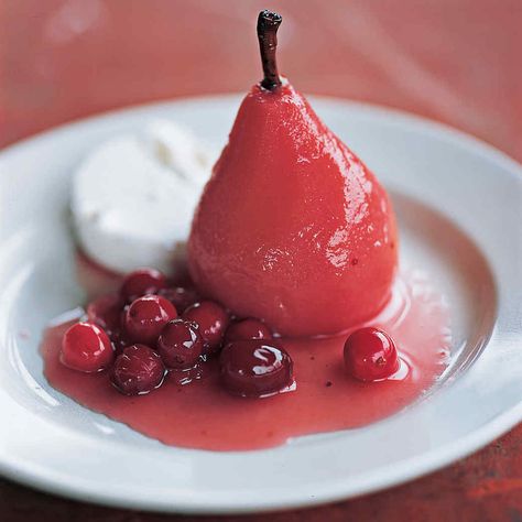 Pears take on an eye-catching crimson cast when poached with vibrant cranberries. Their pleasing tartness can be countered by a sliver of rich goat cheese or a dollop of creme fraiche or yogurt. Poached Pears Recipe, Fresh Cranberry Recipes, Pumpkin Puree Recipes, Pear Dessert, Cinnamon Ice Cream, Dessert Simple, Pear Recipes, Poached Pears, Cranberry Recipes