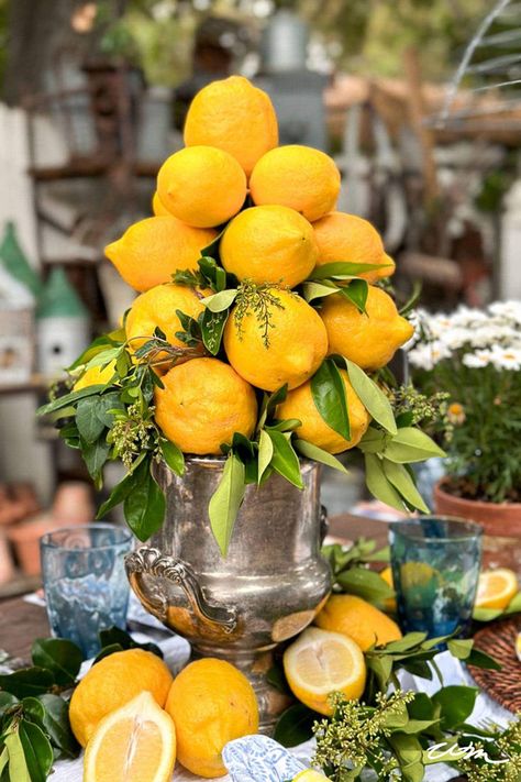 Elevate your table with a lively DIY lemon centerpiece! This easy and stunning DIY brings a burst of citrus charm to any space. With just a few materials and straightforward instructions, you can create a gorgeous centerpiece using fresh lemons. Perfect for gatherings or simply to add a cheerful touch to your dining room or kitchen! For more DIY ideas and detailed intructions check out WMDesignHouse.com! Lemon Centerpiece, Lemon Centerpieces, Italian Flowers, Lemon Crafts, Unique Flower Vases, Family Dinner Table, Italian Party, Lemon Lemonade, Tree Centerpieces