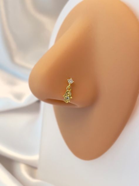 ---Please read the description of the items carefully, including the size and post length, to avoid disappointment if it doesn't fit upon arrival! ---STERLING SILVER NOSE STUD--- -Dainty nose studs, nose jewelry -GAUGE (Thickness): 22 GAUGE (0.5 MM) -Post approx. 6-9 MM -Sold per piece (not a pair) -METARIAL : High quality 925 Sterling Silver Color gold -14K Gold Plated -FINISH: Polished -100% top quality -PACKAGING: All orders come in our pretty packaging, ready for gifting. --Shipping usually Evil Eye Nose Ring, Nose Piercing Black Woman, Nose Piercing Gold, Indian Nose Piercing, Gold Nose Piercing, Stud Nose Piercing, Cute Nose Rings, Nose Ring Indian, Silver Nose Stud