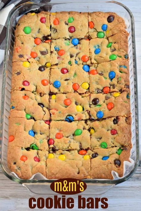 Chewy M&M's Chocolate Chip Cookie Bars are thick and delicious and perfect when you need a quick dessert. Perfect for holidays and bake sales too! Cake Mix Bars, Cake Mix Cookie, Cake Mix Cookie Bars, Cake Mix Desserts, Chocolate Chip Cookie Bars, Simple Cake, Dessert Cake Recipes, Cookie Bar Recipes, Delicious Cake