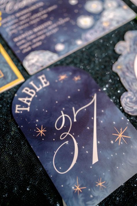 Celestial-themed wedding table decor with a starry night design. Perfect for creating a dreamy, magical atmosphere. #StarryNightWedding #VanGoghInspiredWedding #CelestialWeddingTheme #UniqueWeddingDecor #ElegantWeddingIdeas #StarryNightDecor #ArtInspiredWeddings #WeddingStationeryGoals #SunflowersAndStars #RomanticWeddingVibes #WhimsicalWeddingDecor #CreativeWeddingDetails #TableDecorInspo #ThemedWeddingDesign #DreamyWedding #MagicalTableDecor #EtherealWeddings #NightSkyElegance #EnchantingDecor Starfall Wedding Theme, Starry Wedding Theme, Van Gogh Wedding Theme, Galaxy Wedding Theme, Galaxy Themed Wedding, Celestial Wedding Decor, Celestial Themed Wedding, Elegant Indian Wedding, Celestial Wedding Theme