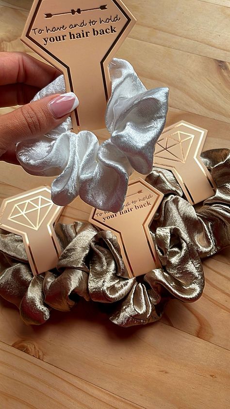 "Here at Berry Personal Gifts we are super excited to be selling these cute packs of satin scrunchies for you and the bridesmaids!  In this pack you will receive 1x white satin  scrunchie and 6x coloured satin scrunchies (rose gold or bronze) What a wonderful gift to  give to someone to show them how much they mean to you. Each Scrunchie comes with a diamond tag which on the flip side states \"To have and to hold, you're hair back\" These are perfect for bridesmaid proposal, hen dos, morning of the big day and so much more. The inner of the hair scrunchies measure approx 4cm wide and the whole scrunchie around 12cm. Any questions about this item or any others please do not hesitate to contact us! Take Care, The BPG Team x" Team X, Rose Gold Satin, To Have And To Hold, Personal Gifts, Satin Scrunchies, Cute Wedding, Hens Night, Hair Scrunchies, Hen Do