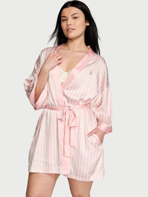 Specially designed for The Tour '23, this silky satin robe is one of our most essential styles, now back and better than ever in the iconic pink Victoria's Secret stripe you know and love. Wrap robe with tie waist Relaxed fit Flared sleeves Embroidery details Knee length Machine wash Imported Silky Robe, Lingerie Catalog, Women's Robe, Love Is In The Air, Pink Stripes, Lace Sleeves, Flared Sleeves, Victoria's Secret Pink, I Dress