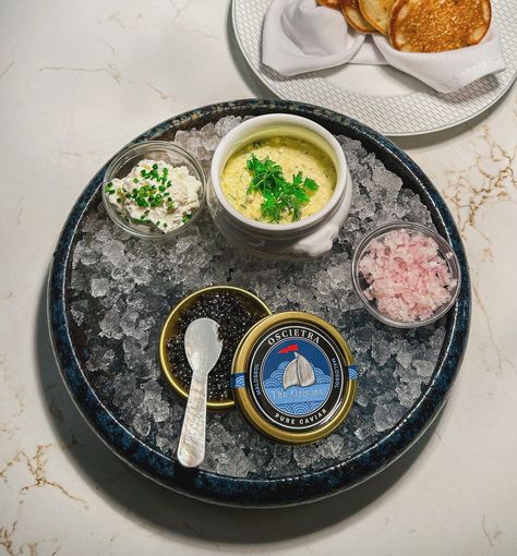 Curious about caviar? We are pleased to offer @calvisiuscaviarusa 𝘾𝘼𝙑𝙄𝘼𝙍 𝙎𝙀𝙍𝙑𝙄𝘾𝙀 nightly. This fresh, sustainable caviar from Italy is the perfect introduction for those who are new to this delicacy.✨ Selections include 10g of 𝙏𝙍𝘼𝘿𝙄𝙏𝙄𝙊𝙉 𝙋𝙍𝙀𝙎𝙏𝙄𝙂𝙀 or 𝙊𝙎𝘾𝙄𝙀𝙏𝙍𝘼 and 1g of 𝙎𝙄𝘽𝙀𝙍𝙄𝘼𝙉 𝙊𝙍𝙄𝙂𝙄𝙉𝘼𝙇 or 𝙏𝙍𝘼𝘿𝙄𝙏𝙄𝙊𝙉 𝙍𝙊𝙔𝘼𝙇. All are served with 𝘢𝘤𝘤𝘳𝘰𝘶𝘵𝘳𝘦𝘮𝘦𝘯𝘵𝘴 𝘵𝘳𝘢𝘥𝘪𝘵𝘪𝘰𝘯𝘯𝘦𝘭 of kizami blinis, brown butter gribiche, and shallot marinee. Not sure if caviar is for you? Sample a taste of luxury with our introductory ... Caviar Service, Fine Dining Plating, Brown Butter, Shallots, Fine Dining, The Prestige, Tart, Butter, Plating