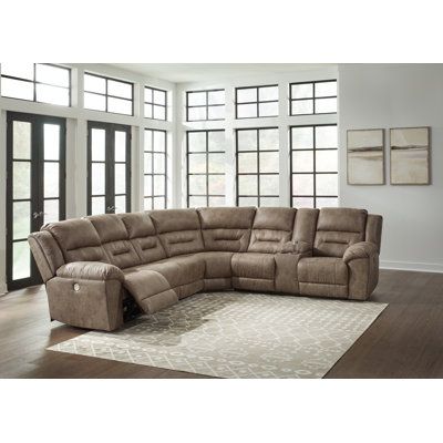 This power reclining sectional is designed exclusively for those who are serious about R&R. Its overstuffed cushions and pillow top arms feel oh-so-plush, and the faux leather upholstery accented with jumbo stitching is silky soft. Go from upright to reclined relaxation with just one touch. A clever center console provides storage and keeps drinks at the ready. Signature Design by Ashley Orientation: Right Hand Facing | Fossil Reclining Sectional - Signature Design by Ashley Ravenel 4 - Piece Ve