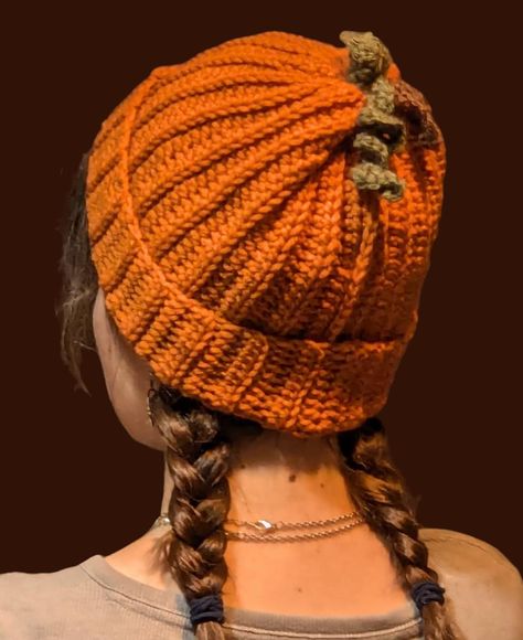 Handmade Crochet Pumpkin beanie! Made from soft orange 100% acrylic yarn, with brown stem and green leaf and vine on top. Warm and Cozy, one size fits most (Model hat size is 23"), no lining but thick material. Crochet Pumpkin Hat Pattern, Crochet Fruit Beanie, Crochet Fall Beanie, Crochet Pumpkin Beanie, Orange Crochet Projects, Pumpkin Crochet Hat, Crochet Bras, Pumpkin Hat Crochet, Pumpkin Hat Pattern