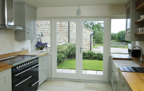 French doors with flag windows finished in Off-White, with a Satin Chrome Windsor handle and manufactured in Engineered European Redwood. Doors To Outside Patio, Kitchen Doors To Outside, Kitchen Patio Doors, Traditional French Doors, Bifold Patio Doors, Interior Design Living Room Modern, Interior Design Kitchen Small, Timber Windows, French Doors Patio