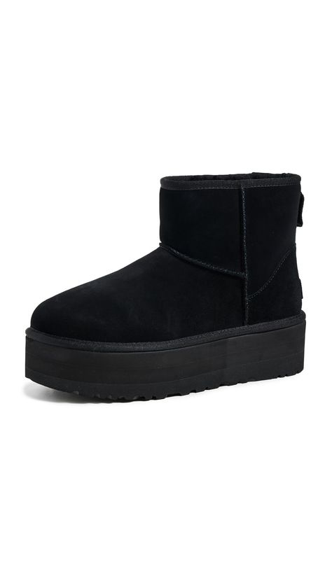 PRICES MAY VARY. Suede upper Overlock stitch detailing on seams 17mm UGGplush upcycled wool lining and sockliner Treadlite by UGG outsole 2" platform height Cozy Wishlist, Ugg Plateau, Ugg Classic Mini Platform, Cute Uggs, Uggs Black, Clothing Finds, Ugg Winter Boots, Overlock Stitch, Black Uggs