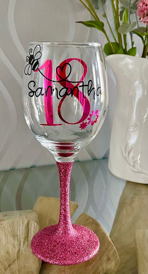 Add that little extra sparkle to any celebration with our beautiful personalised  glasses. This particular Glass can be personalised with the the name of a loved one with your age of choice. The stems and bases of the glasses are fully glittered the same colour as the age on the glass. The perfect gift for someone special. A wide range of colours are available. Your name will be written in black across the age (unless you request otherwise), which will be in the colour of your choice. The beauti