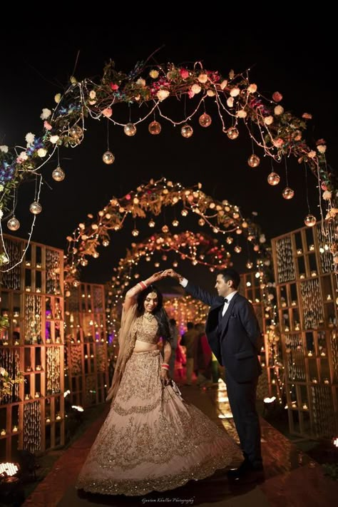 A Dreamy Delhi Wedding With A Bride In A Bright Coral Lehenga Pathway Decor Wedding Indian, Indian Wedding Passage Decor, Wedding Enterence Ideas, Indian Wedding Entry Decor, Wedding Entrance Decoration Indian, Wedding Entry Decor, Wedding Passage, Coral Lehenga, Wedding Entry