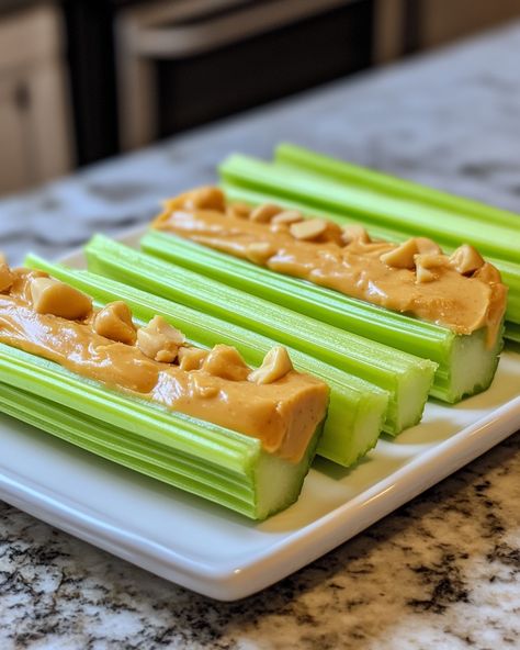 This classic snack brings back so many childhood memories! It’s simple, healthy, and always delicious!  Ingredients: - Fresh celery stalks - Creamy peanut butter - Raisins (optional)  For full preparation steps, please check the link in the first comment [👇] [👇].  This snack is perfect for a quick energy boost or a fun after-school treat. I love how crunchy the celery is with the smooth peanut butter—such a great combo!   #CelerySnacks #HealthyEating #PeanutButterLove #QuickEats #ComfortFood Celery Peanut Butter Snacks, Celery With Peanut Butter, Peanut Butter And Celery, Celery Snack Ideas, Celery And Peanut Butter, Celery Peanut Butter, Celery Snacks, Smooth Peanut Butter, Peanut Butter Snacks