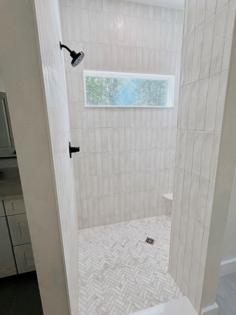 Master bath design. Shower tile. Bath tile. Herringbone tile. White tile bathroom. Walk in shower. Verticle Tile Showers, Herringbone Shower Floor, River Bathroom, White Tile Bathroom, White Shower Tile, Cleaning Bathroom Tiles, White Herringbone Tile, Bathroom Downstairs, White Tile Shower