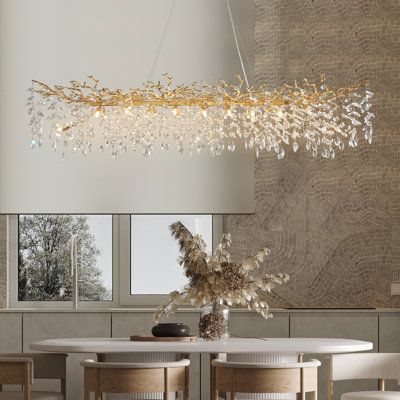 This raindrop chandelier comes from the beauty and delicacy of the natural forest itself, which embraces the tenacious and primitive side of nature, with glass raindrops on the branches shimmering like diamonds, making the chandelier look like an ice tree, very close to the visual density of its inspired waterfall-like. The pendant lights are designed as a branch with blossoms, Shining, and luxury, a symbol of harvest(Love, career, family, friendship). This hanging light is perfect for the dinin Glass Raindrops, Ice Tree, Raindrop Chandelier, Chandeliers Modern, Natural Forest, Rectangular Chandelier, Crystal Chandelier Lighting, Rectangle Chandelier, Crystal Chandeliers