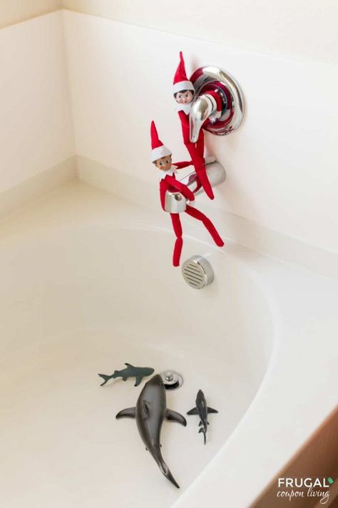 Danger below! For this Elf on the Shelf Shark Idea, don't let the elves fall in the bathroom tub shark tank below. New Elf on a Shelf ideas daily plus free Elf on the Shelf printables including Elf on a Shelf Baby Shark printables. #sharktank #FrugalCouponLiving #ElfontheShelf #ElfontheShelfIdeas #ElfIdeas #funnyelfideas #funnyelfontheshelf #elfprintables #freeelfprintables #printables #freeprintables #ElfonaShelf Elf In The Bathroom Ideas, Beach Elf On The Shelf, Elf On The Shelf In The Bathroom, Elf On The Shelf Beach Ideas, Elf On The Shelf Ideas Bathroom, Two Elves On The Shelf Ideas, Elf Bathroom Ideas, Elf On The Shelf Mermaid, Elf On The Shelf Bathroom Ideas