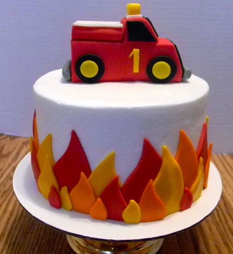 Firetruck Cake. Adorable @Nissa Little Cardenas I don't like this firetruck but the flame idea is cute and simple Playmobil Cake, Firefighter Cakes, Fireman Sam Birthday Cake, Fondant Fancies, Firefighter Birthday Cakes, Fire Engine Cake, Fireman Sam Cake, Fire Truck Cake, Fire Engine Birthday