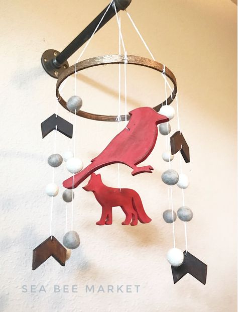 Memorial cardinal and fun woodland fox with Poms and arrows. This is the perfect mobile for a farmhouse nursery, lumberjack nursery, woodland nursery. Sleek lines. Totally hand made from scratch! @seabeemarket on Facebook, Instagram, and Etsy. #farmhousenursery #woodland #nursery #nurserydecor #inspiration #fox #lumberjack #redandblack #handmade #seabeemarket #cardinal #memorial #ideas #cribmobile #mobile #crib Buffalo Theme Nursery, Woodland Nursery Boy Wreaths & Garlands, Fox Mobile Nursery, Fox Nursery Boy Woodland Animals, Woodland Nursery Mobile Diy Felt Animals, Lumberjack Nursery, Woodland Crib, Farmhouse Nursery, Woodland Fox