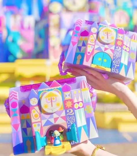 "it's a small world" Popcorn Bucket is a Colorful Tribute to the Attraction - Shop - Disney Popcorn Bucket, Popcorn Holder, It’s A Small World, Disney Furniture, Box With Handle, It's A Small World, Mickey Balloons, Popcorn Bucket, Tokyo Disney