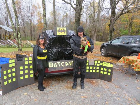 Batcave for a church Trunk or Treat spraypainted some cut up cardboard boxes black and added "windows" from squares cut out of bright yellow paper. Added the bat symbol, Gotham City and Batcave lettering and lined the trunk with large trash bags. Attached a bat hanging decoration with magnets to the trunk door and put some flashing lights in the trunk. It was a hit. Batman Trunk Or Treat Ideas For Cars, Batman Trunk Or Treat, Church Trunk Or Treat, Church Trunk, Bat Hanging, Batman Decor, Bat Symbol, Black Truck, Adam West