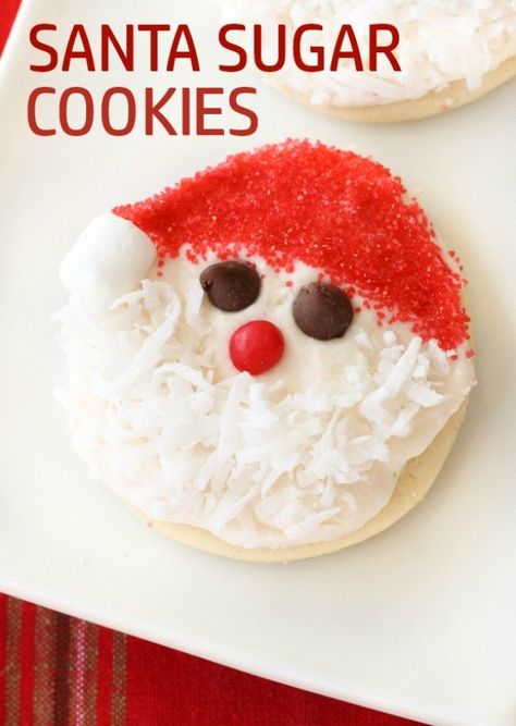 Santa Sugar Cookies | Six Sisters' Stuff These Santa Sugar Cookies are such a fun idea for Christmas. They are our favorite sugar cookie recipe. They have a secret ingredient that makes them moist and soft. You are going to love this recipe, and no fancy cookie cutter is needed! #santa #cookies Santa Cookies Recipes, Santa Sugar Cookies Decorated, Santa Face Cookies, Santa Sugar Cookies, Santa Cookie Recipe, Friendsgiving Ideas, Cinnamon Sugar Cookies, Santa Cookie, Six Sisters Stuff