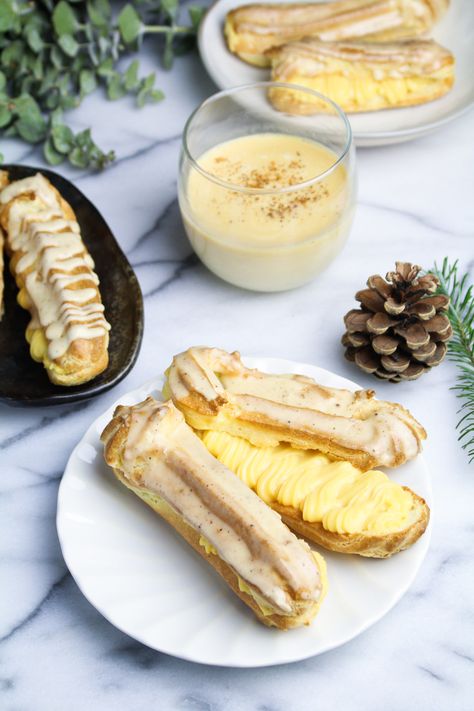 Spiked Eggnog Eclairs with Nutmeg Glaze; richest eggnog pastry cream made with only eggnog, tons of yolks, starch and butter Eggnog Recipe Homemade, Christmas Eggnog, Spiked Eggnog, Eggnog Recipe, Holiday Goodies, Pastry Cream, Kitchen Door, Eclairs, Pastry Recipes