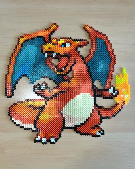 Liara Rodriguez-Castro | SOLD-This Perler Bead Charizard is one of my favorite projects to date! He is going up in my shop at 12:30pm Eastern tomorrow (04/23)at a… | Instagram Perler Bead Charizard, Pokemon Date Ideas, Charizard Perler Beads, Pokémon Perler Beads, Pokemon Perler Bead Patterns, Bead Pokemon, Perler Bead Pokemon Patterns, Hama Beads Pokemon, Pokémon Perler