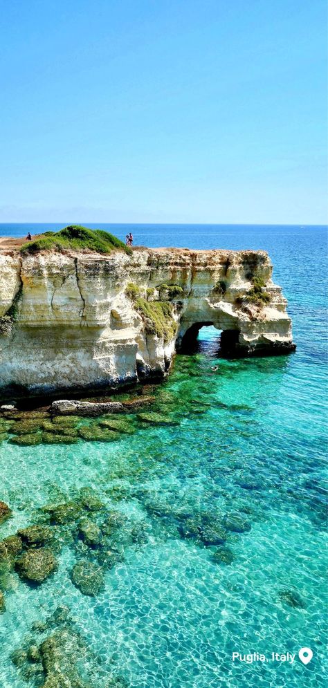 Turquoise water leads up to a limestone rock formation sticking out of the water on a sunny day. September Travel, September Holidays, Sun Aesthetic, Fall Months, Southern Region, Italy Aesthetic, Where To Travel, Sunny Weather, Holiday Destinations