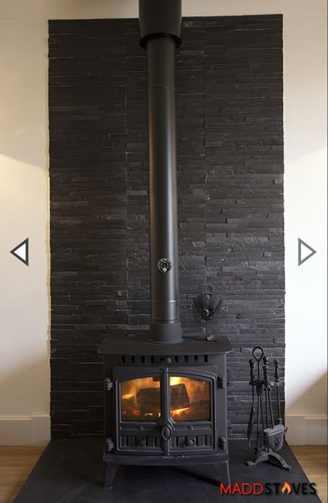 Modern Living Room With Wood Stove, Wood Burning Stove Feature Wall, Black Brick Wood Stove, Black Brick Behind Wood Stove, Corner Wood Stove Ideas Modern, Black Wood Stove Surround, Wood Burning Stove Accent Wall, Modern Woodburner Ideas, Free Standing Wood Burning Fireplace Ideas