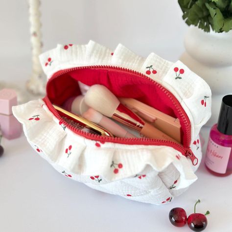 These makeup bags make a perfect gift for anyone who loves cosmetics, creams, or travel-size shampoos. They're also great for storing jewelry, hair accessories, stylers, dryers, and other essentials. If you're always on the go, moving from place to place, these bags will be a lifesaver for keeping your beauty products organized and easy to carry. Approximate dimensions of cosmetic bags:  S - 7.1x4.7 in (18x12 cm) M - 9.8x5.5 in (25x14 cm) L - 13.8x5.9 in (35x15 cm) Dear customers, when purchasing this listing, you will receive only the cosmetic bag. The decorative items in the photos and any cosmetic products used for styling are not included in the set The small makeup bag is ideal for minimalists who use just a few beauty essentials--like lipstick, lip gloss, a mini brush, a compact with Travel Size Shampoo, Coquette Cherry, Cottagecore Gifts, Storing Jewelry, Mini Brush, Small Makeup Bag, Handmade Cosmetics, Jewelry Hair Accessories, Small Makeup