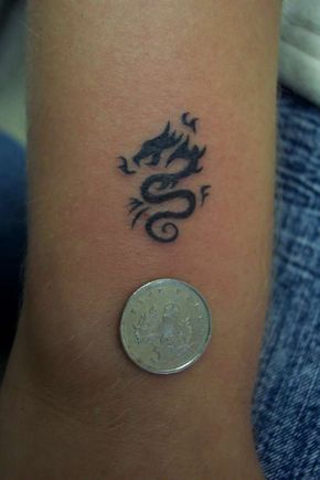 100+ Simple & Elegant Tattoo Designs - Hongkiat Dragon Tattoo Simple, Dragon Hand Tattoo, Dragon Tattoo Arm, Dragons Tattoo, Small Dragon Tattoos, Simple Tattoos For Women, Small Dragon, Dragon Tattoo For Women, Inspiration Tattoos